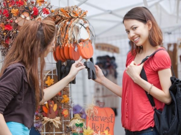woman shopping at well organized craft show